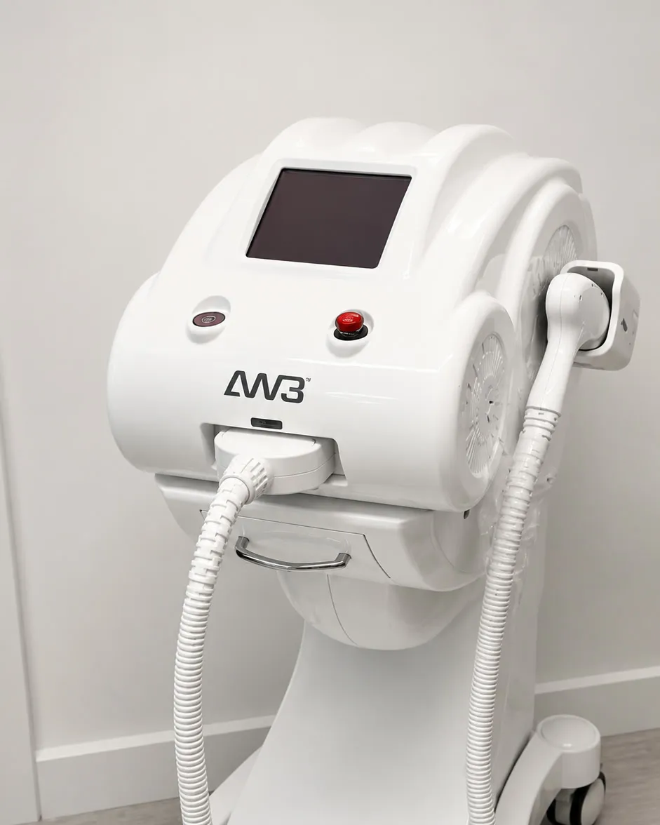 The AW3 Q-switched Nd:YAG laser used at Erase My Ink, showing the control screen and both handpieces